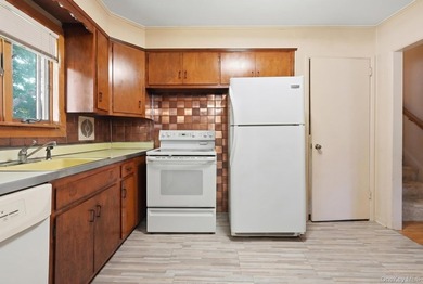 Welcome to this beloved split-level home in the heart of Wantagh - photo 9