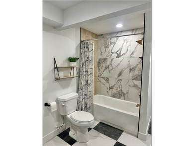 This beautifully remodeled home sits hidden, tucked away on a - photo 24