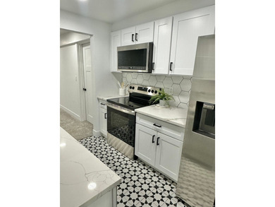This beautifully remodeled home sits hidden, tucked away on a - photo 25