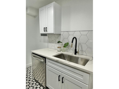 This beautifully remodeled home sits hidden, tucked away on a - photo 26