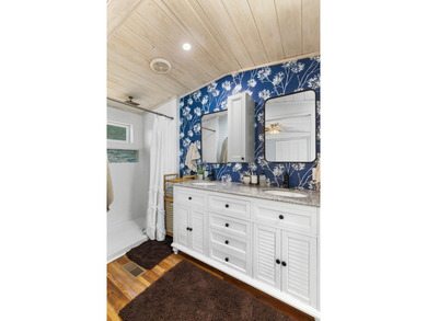 Welcome home to this charming, fully updated lake retreat on - photo 16