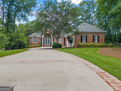 Nestled on 1.50 beautifully landscaped acres in the sought-after - photo 3