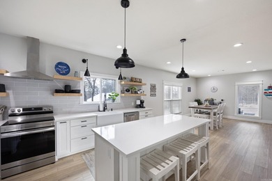 This stunning 3,500-square-foot lake home, located less than 2 - photo 3