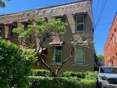 Spacious attached 1920's 3 family brick home. Two Bedrooms/1 - photo 2