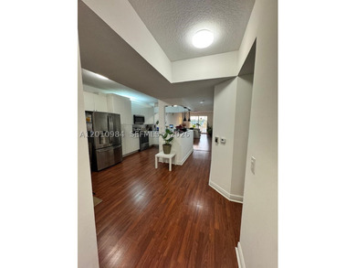 Third-floor apartment located in the community of Doral Isles - - photo 9