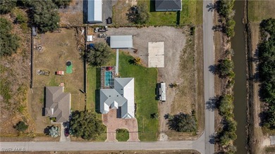 Stunning Custom Estate on 1 Acre Corner Lot with Pool, Metal - photo 32