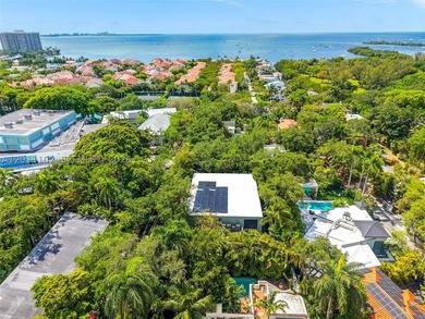 Stunning Coconut Grove residence showcasing soaring ceilings and - photo 34