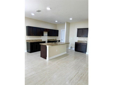 This 4/2 home has a renovated interior showcasing modern - photo 4
