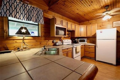 Cozy Log Cabin Tucked Away in the Trees Take the steps down to - photo 6