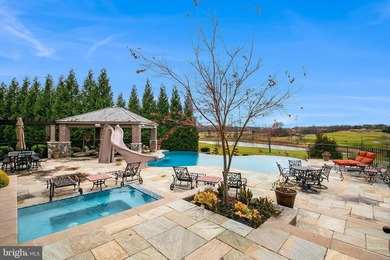 Welcome home to this remarkable estate set behind the gates of - photo 4