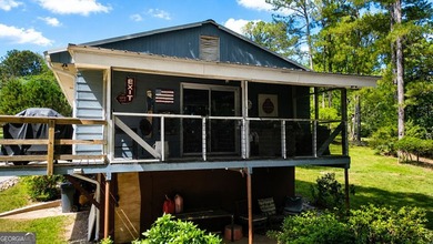 This cute cabin on year-round deep water is the lakefront - photo 11