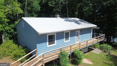 This cute cabin on year-round deep water is the lakefront - photo 17
