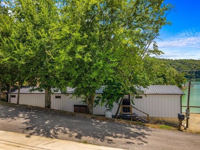 Welcome home to this charming, fully updated lake retreat on - photo 2