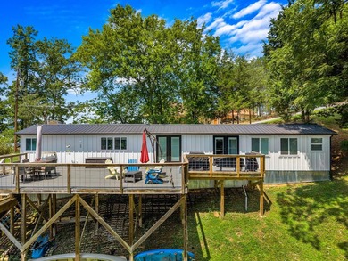 Welcome home to this charming, fully updated lake retreat on - photo 3