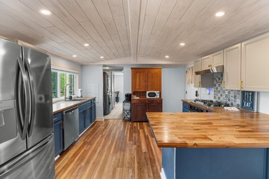 Welcome home to this charming, fully updated lake retreat on - photo 10