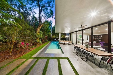 Stunning Coconut Grove residence showcasing soaring ceilings and - photo 5