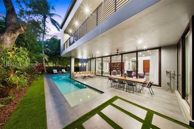 Stunning Coconut Grove residence showcasing soaring ceilings and - photo 7