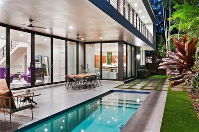 Stunning Coconut Grove residence showcasing soaring ceilings and - photo 8