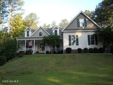 Lake Home For Sale in Whispering Pines, North Carolina
