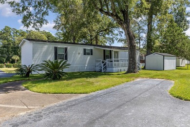 Nestled in the tranquil and gated community of Owens Mobile Park - photo 3
