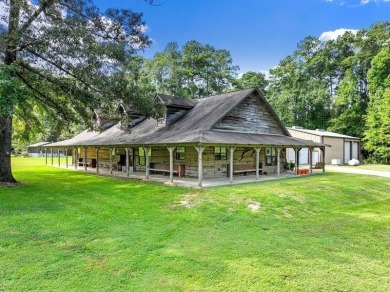 Nestled on 21 picturesque acres, this 4-bedroom, 3-bath rustic - Lake Home For Sale in Brookeland, Texas