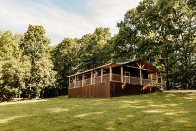 Tucked away on 2 private acres among the trees, *Simmer Down* is - photo 1