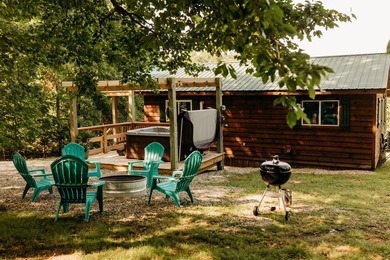 Tucked away on 2 private acres among the trees, *Simmer Down* is - photo 2
