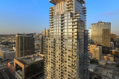 Perched high on the 27th floor, this rare end unit residence at - photo 8