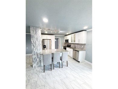 Experience modern luxury in this stunning, fully renovated - photo 5