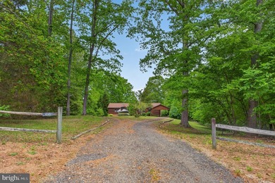 Tucked away on four private wooded acres with over 400 feet of - photo 2
