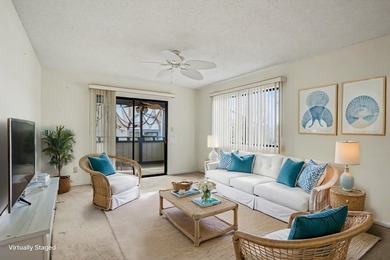 Walk to the beach from this charming top floor end unit 2 bed 2 - photo 5