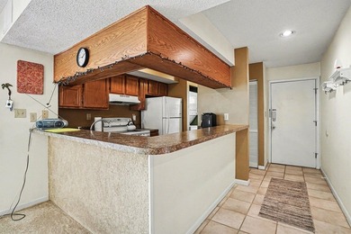 Walk to the beach from this charming top floor end unit 2 bed 2 - photo 9