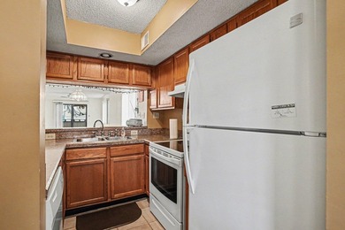 Walk to the beach from this charming top floor end unit 2 bed 2 - photo 10