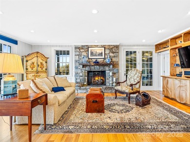 Commanding one of Asheville's most awe-inspiring mountain