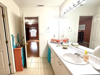 Welcome to this 3 BR/2 BA end unit on a corner cul-de-sac lot