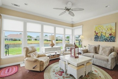 Set on a large premium lot with peaceful lagoon views, timeless - photo 1
