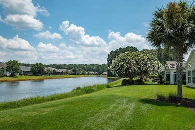 Set on a large premium lot with peaceful lagoon views, timeless - photo 3