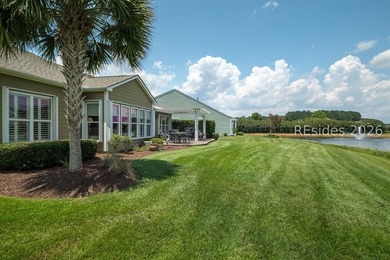 Set on a large premium lot with peaceful lagoon views, timeless - photo 4