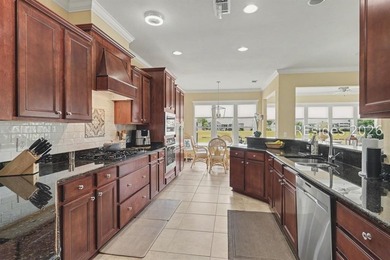 Set on a large premium lot with peaceful lagoon views, timeless - photo 10