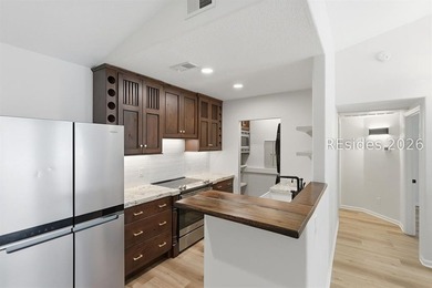 Extensively renovated in 2023, this second-floor end unit offers - photo 9