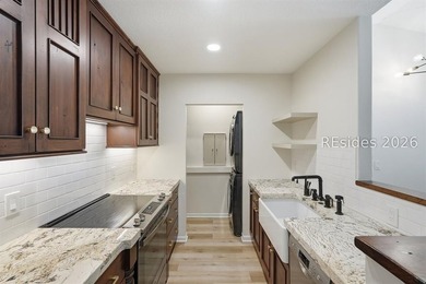 Extensively renovated in 2023, this second-floor end unit offers - photo 10