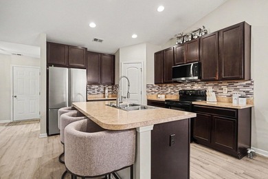 This 3-bedroom, 2-bath home offers added privacy with protected - photo 6