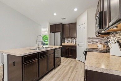 This 3-bedroom, 2-bath home offers added privacy with protected - photo 7