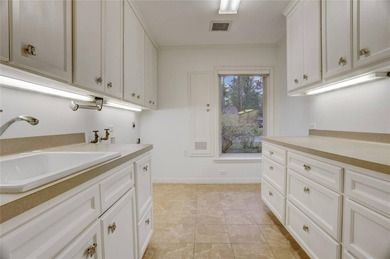 Tucked beneath towering mature trees, this sprawling ranch home - photo 20