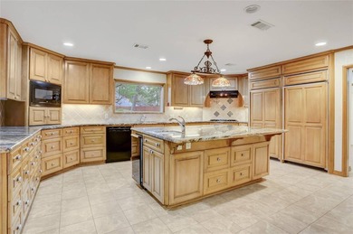 Tucked beneath towering mature trees, this sprawling ranch home - photo 21