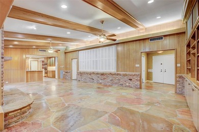 Tucked beneath towering mature trees, this sprawling ranch home - photo 22