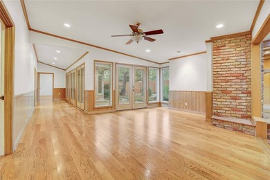 Tucked beneath towering mature trees, this sprawling ranch home - photo 23