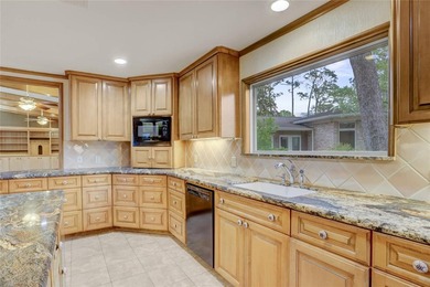 Tucked beneath towering mature trees, this sprawling ranch home - photo 37