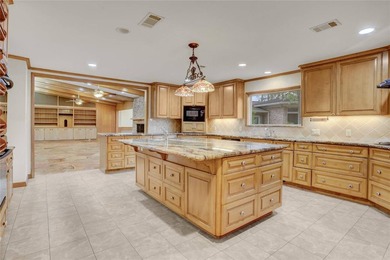 Tucked beneath towering mature trees, this sprawling ranch home - photo 39