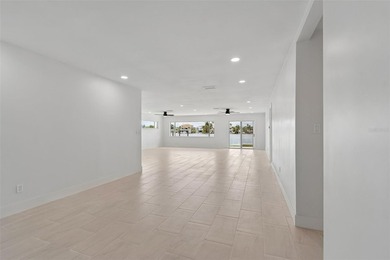 Price Improvement! Experience the pinnacle of refined waterfront - photo 6